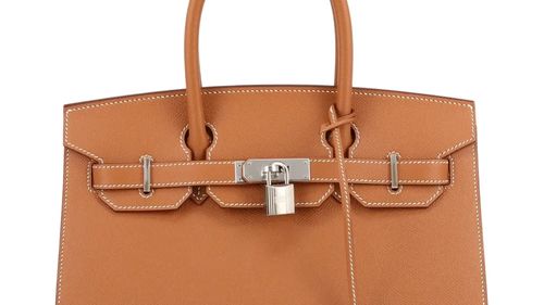 Singapore vinde genți Hermès și lingouri de aur confiscate în cel mai mare caz de spălare de bani din istoria țării