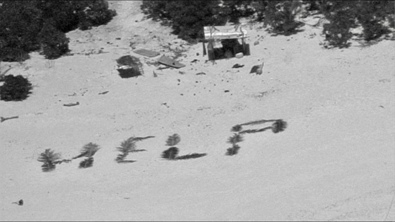 Trei bărbați au fost salvați de Paza de Coastă americană de pe o insulă datorită semnului "HELP", scris pe plajă cu frunze de palmier