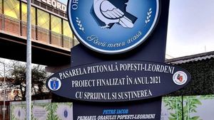 Primarul din Popești-Leordeni, omagiat de subordonați printr-un totem amplasat pe o pasarelă pietonală / City-managerul promite investiții suplimentare în placa omagială