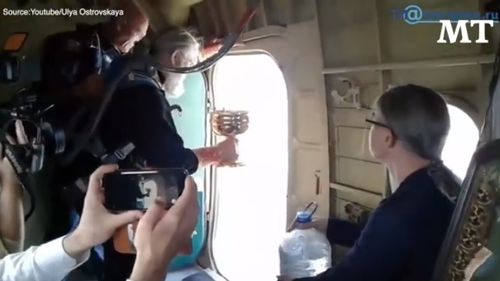 Un oraș din Rusia a fost sfințit din avion cu 70 de litri de agheasmă împotriva beției și a desfrânării