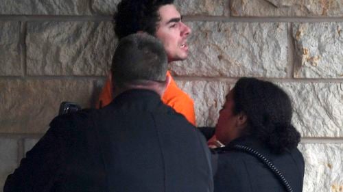 Presupusul ucigaş al unui director de asigurări de sănătate din New York, inculpat pentru act de terorism. El riscă închisoarea pe viață